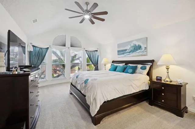 a bed room with a bed and a chandelier