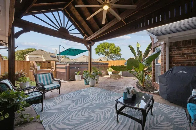 a view of a livingroom with wooden floor and stairs