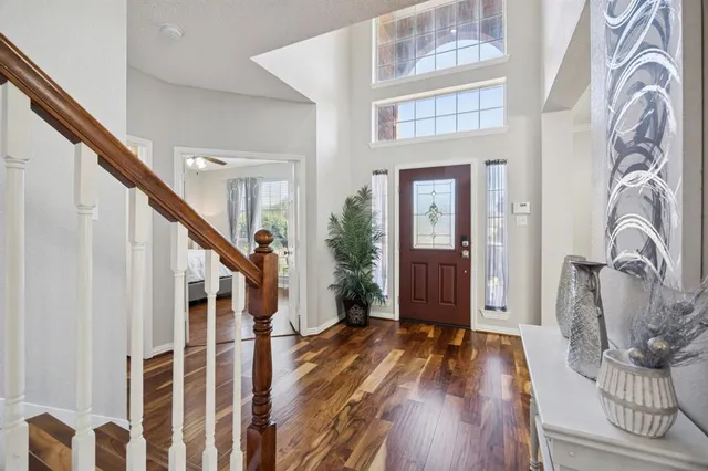 a view of entryway with wooden floor