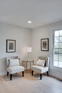 a spacious bedroom with a bed and a couch