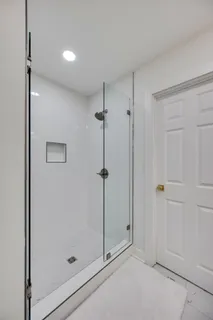 a view of a house with a garage and yard