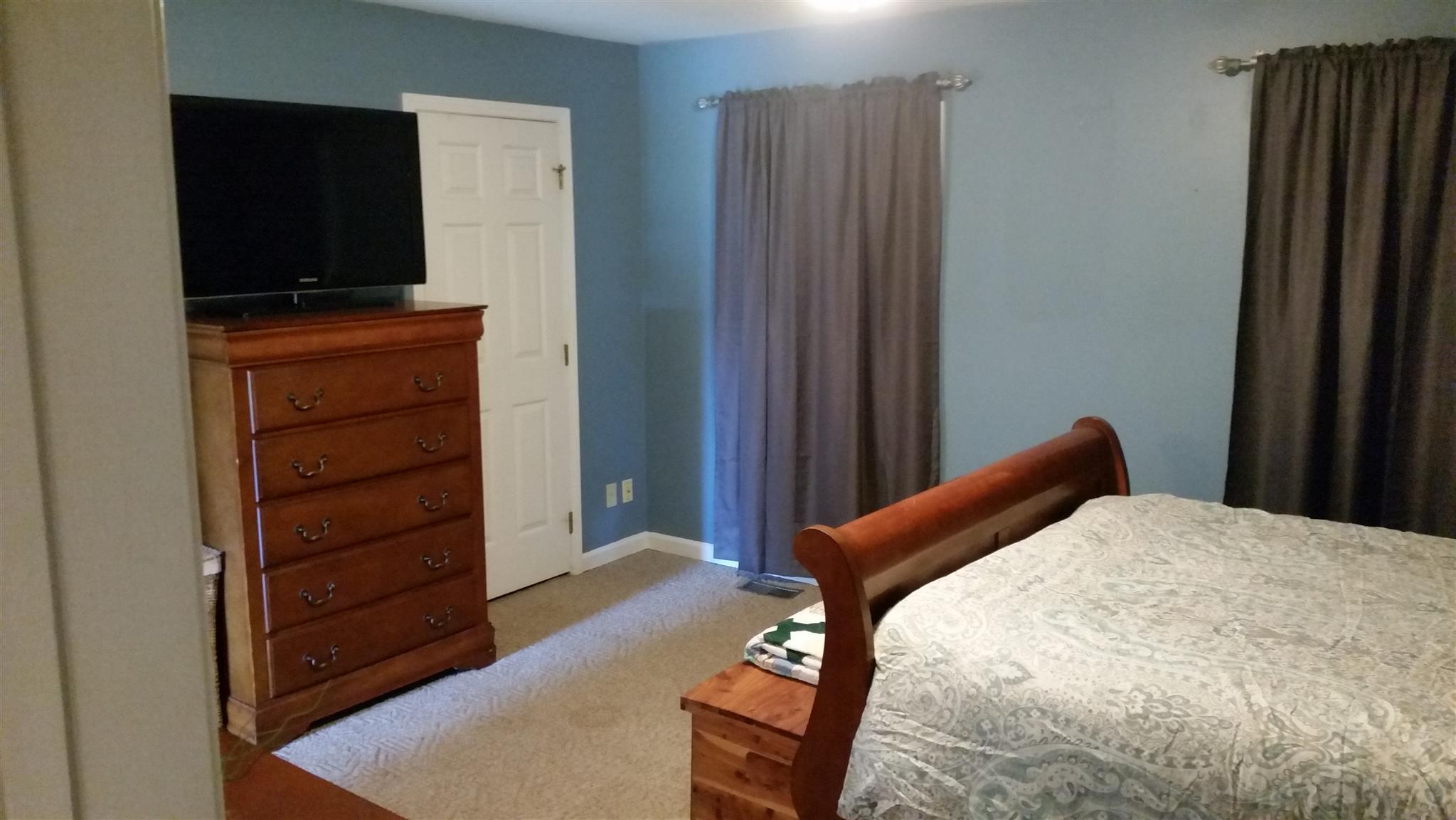 3718 Dobbin Road Springfield, TN 37172 - Photo 13 of 22 a bedroom with a bed and furniture