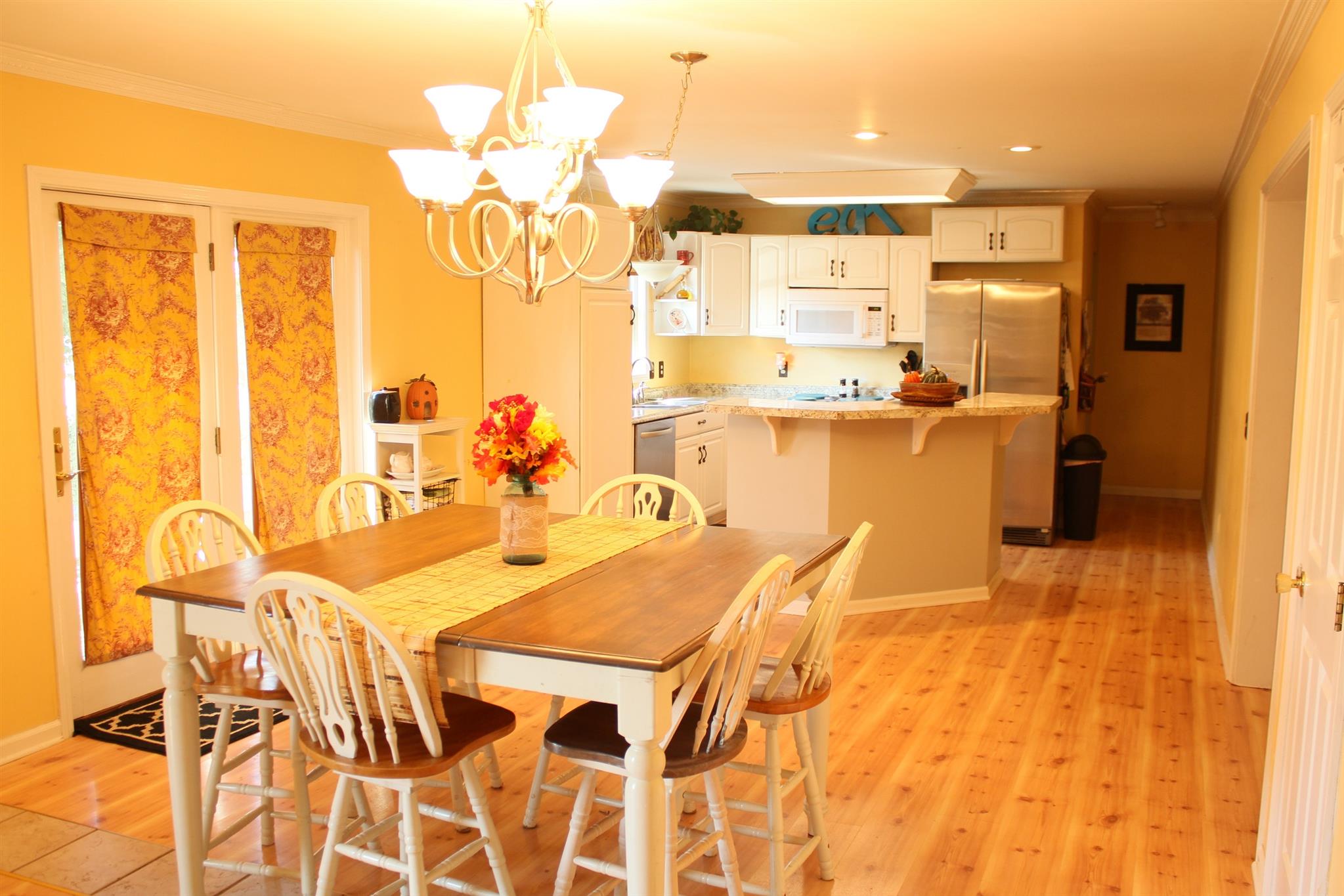 3718 Dobbin Road Springfield, TN 37172 - Photo 9 of 22 a view of a dining room with furniture and a chandelier