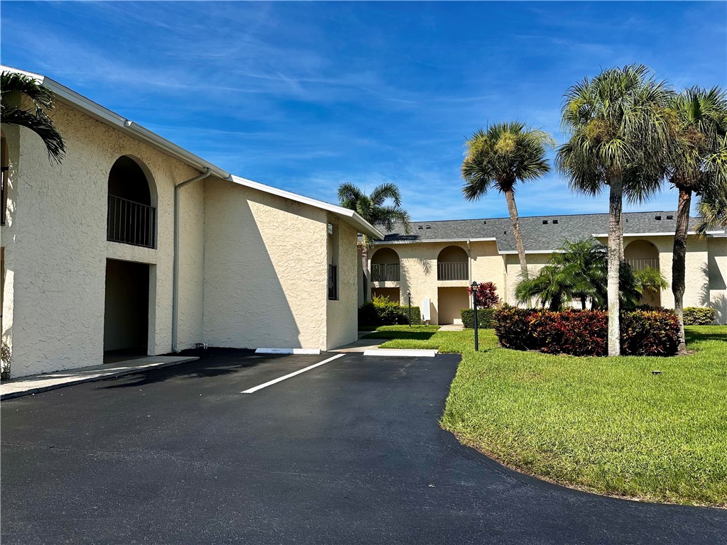 1815 Robalo Drive, Unit C201 Vero Beach, FL 32960 - Photo 24 of 31 a view of a house with backyard and sitting area
