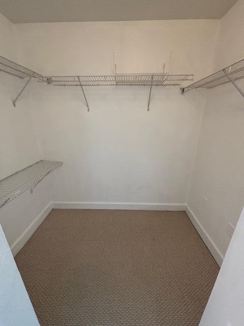 1420 Renaissance Way, Unit 420 Boynton Beach, FL 33426 - Photo 21 of 28 a view of a room with racks on the wall