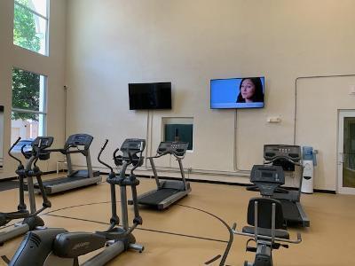 1420 Renaissance Way, Unit 420 Boynton Beach, FL 33426 - Photo 28 of 28 a room with gym equipment and a flat screen tv