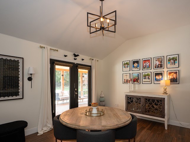 1114 Wagon Road Simonton, TX 77485 - Photo 28 of 48 Charming dining area with double glass doors that open to a scenic outdoor view, creating a bright and inviting space.