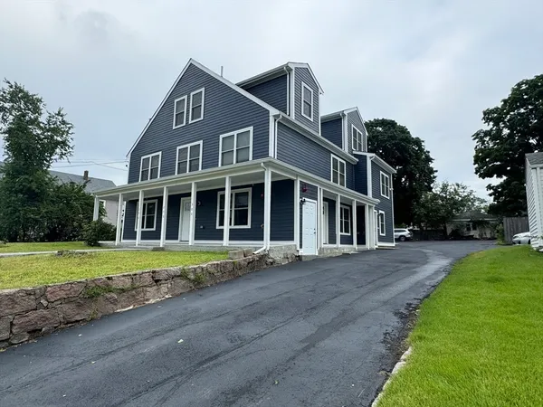a front view of a house with a yard