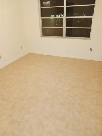 a white toilet sitting next to a shower