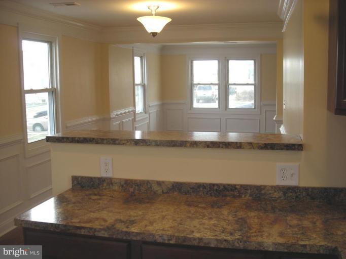 1220 Hilldale Road Rosedale, MD 21237 - Photo 2 of 19 a bathroom with a sink window and a mirror