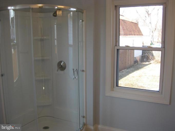 1220 Hilldale Road Rosedale, MD 21237 - Photo 17 of 19 a bathroom with a window and a shower