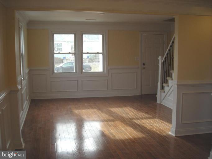 1220 Hilldale Road Rosedale, MD 21237 - Photo 8 of 19 an empty room with windows