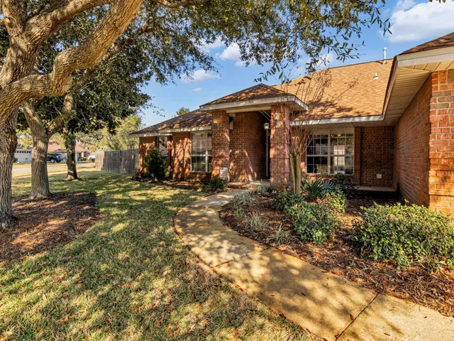 a kitchen with stainless steel appliances granite countertop a sink stove and microwave