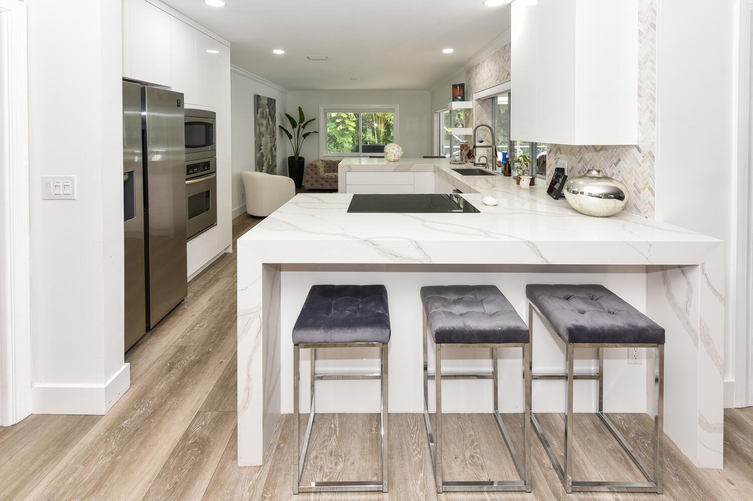 880 Hickory Terrace Boca Raton, FL 33486 - Photo 6 of 38 a kitchen with furniture and a fireplace