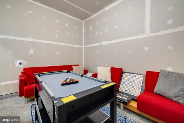 a bedroom with a bed and flat screen tv