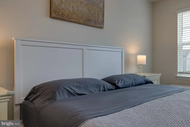 a bedroom with a bed and cabinets