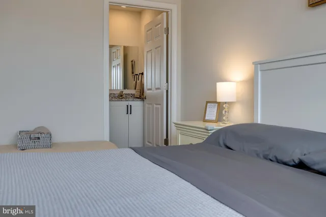 a bedroom with a bed and a television