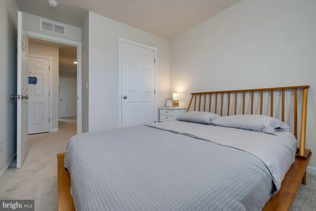 a backyard of a house with barbeque oven and outdoor seating