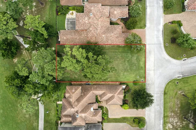 an aerial view of a house with a garden and yard