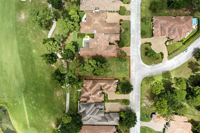 an aerial view of a house with a garden