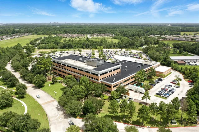 an aerial view of a house with a garden