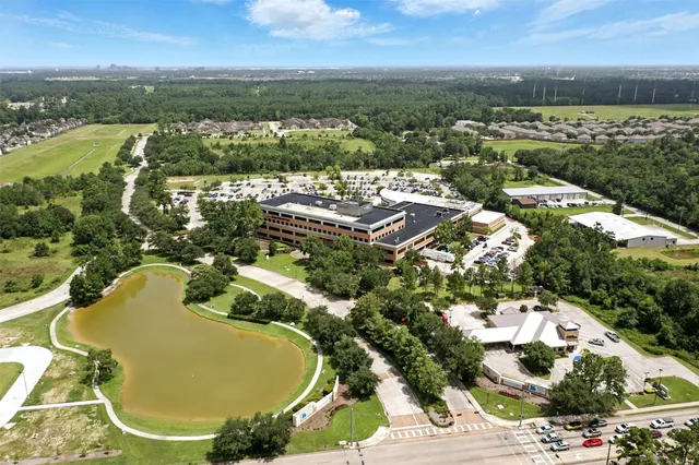 an aerial view of residential houses with outdoor space