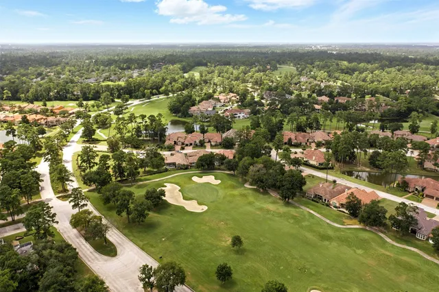 an aerial view of residential houses with outdoor space