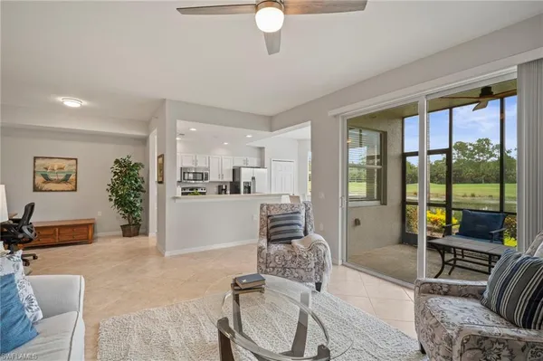 a view of a dining room with furniture and window