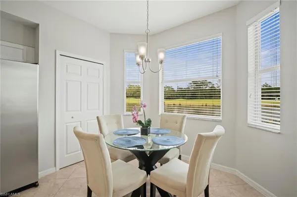a kitchen with stainless steel appliances a refrigerator sink and microwave