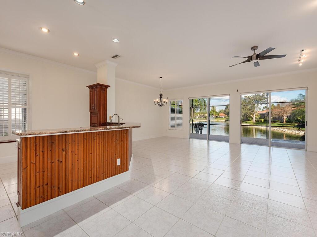 963 Fountain Run Naples, FL 34119 - Photo 3 of 12 a view of an empty room with a window