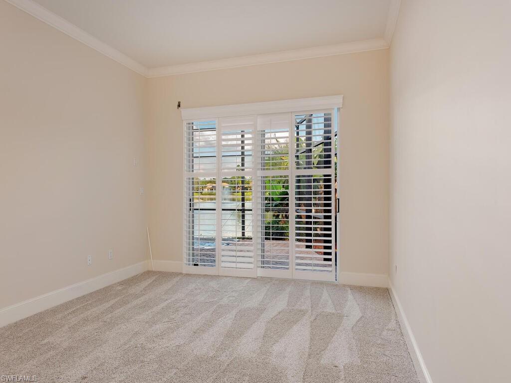 963 Fountain Run Naples, FL 34119 - Photo 6 of 12 an empty room with windows