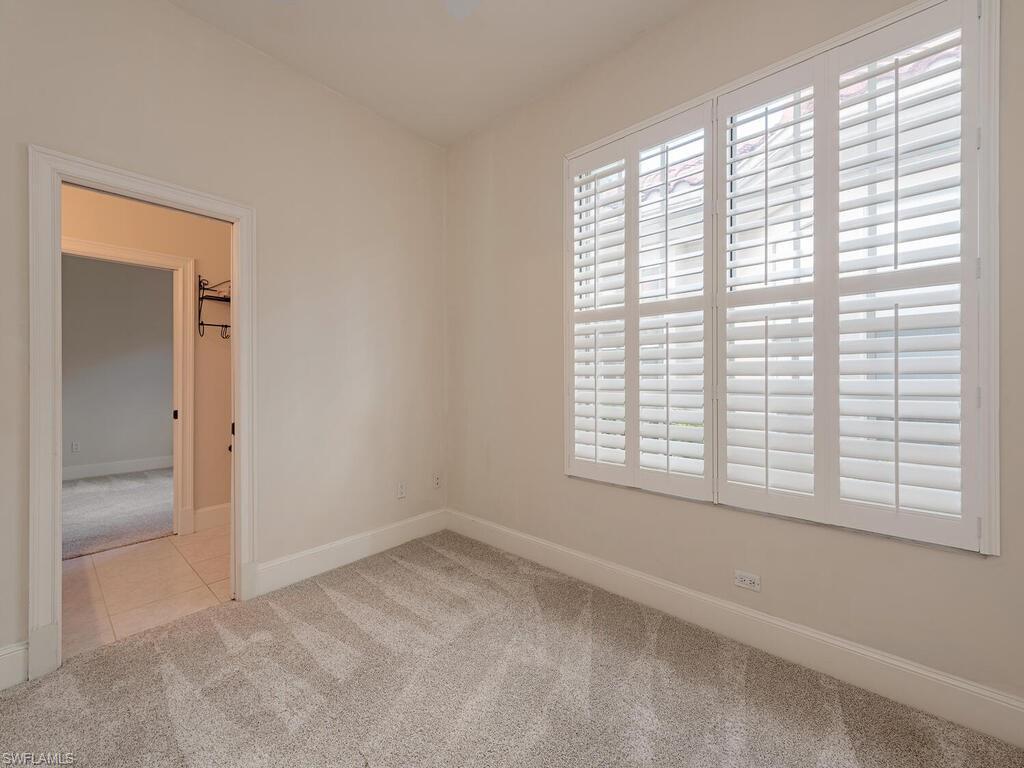 963 Fountain Run Naples, FL 34119 - Photo 8 of 12 a view of a room that has a window in it