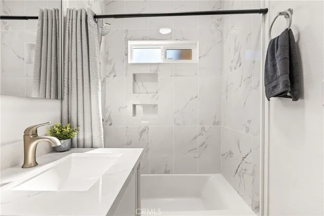 a bathroom with a sink and a bathtub