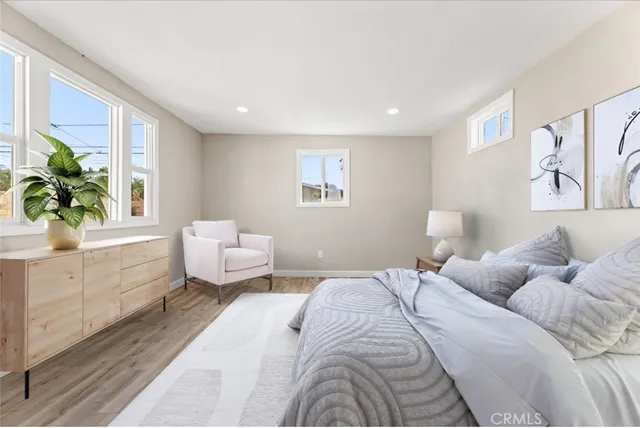 a bedroom with a large bed and a couch