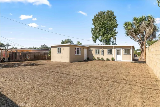 a view of a house with a yard and garage