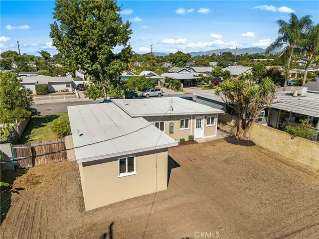 an aerial view of a house with a ocean view