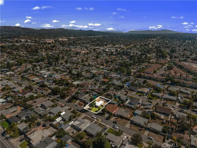 an aerial view of multiple houses with outdoor space