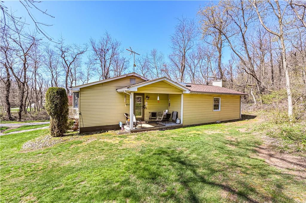 2037 Ridge Road Jeannette, PA 15644 - Photo 22 of 24 a view of a house with backyard and a tree