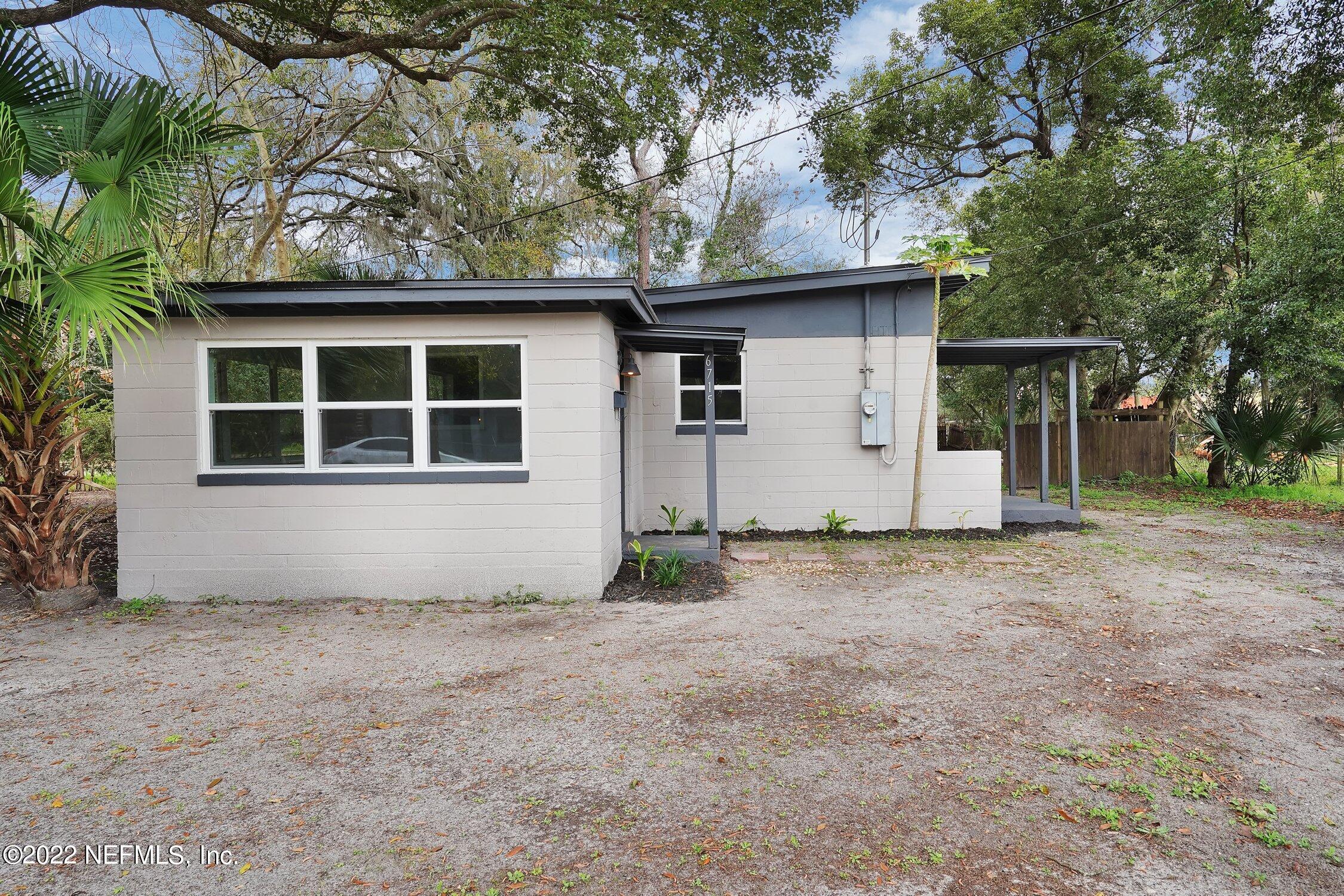 6715 Morgana Road North Jacksonville, FL 32211 - Photo 1 of 27 a house with trees in the background