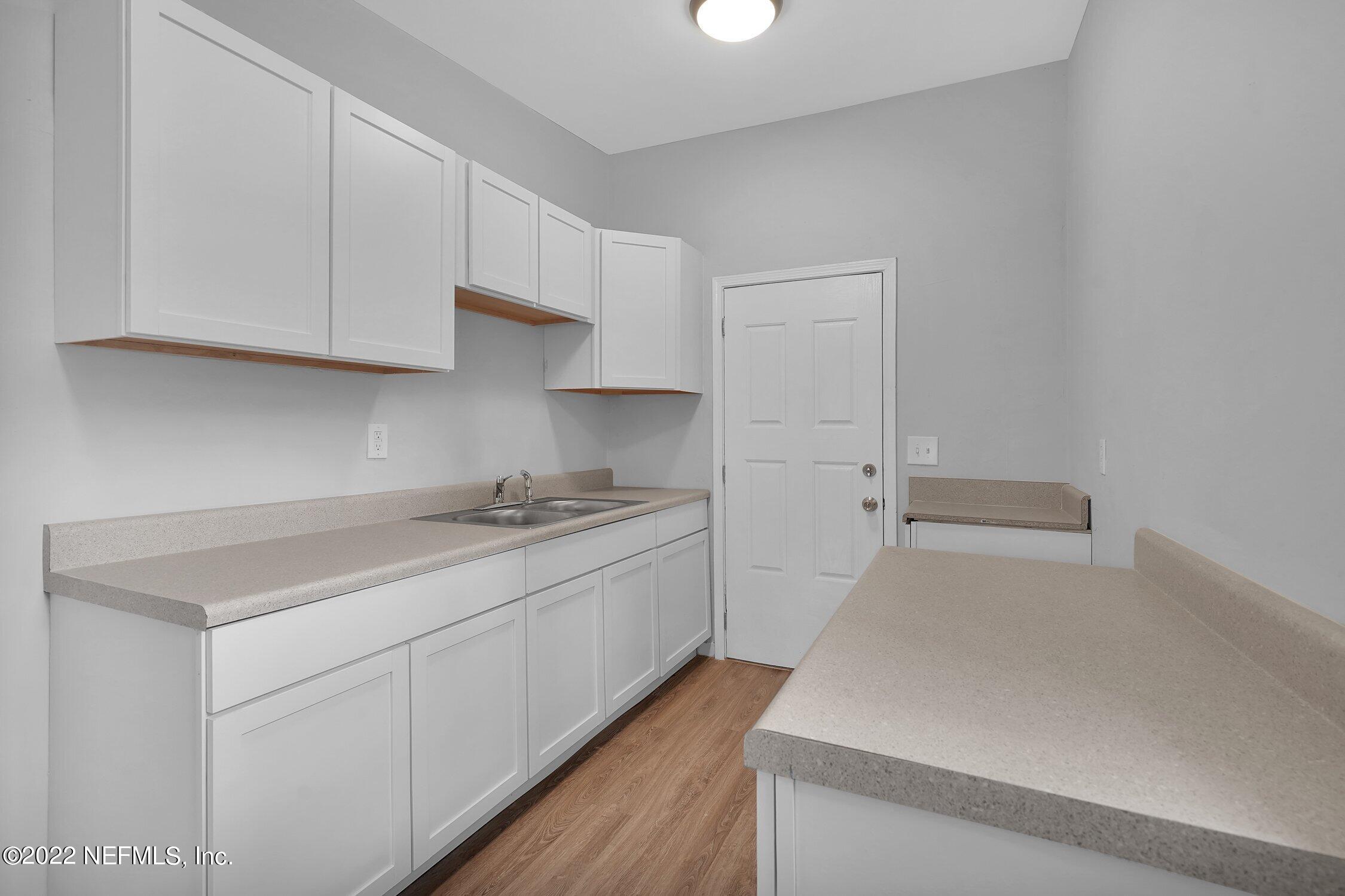 6715 Morgana Road North Jacksonville, FL 32211 - Photo 14 of 27 a kitchen with a sink and cabinets