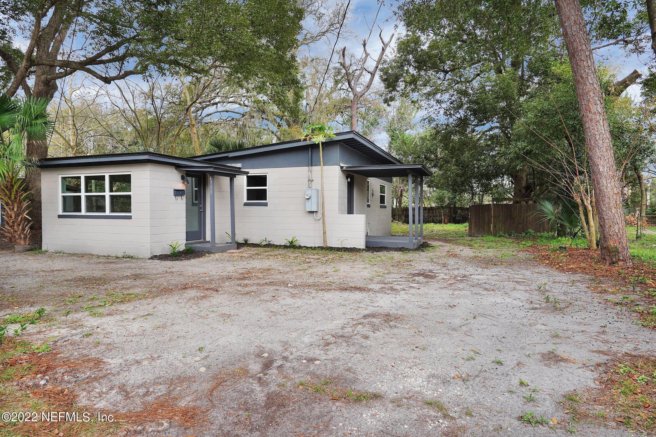 6715 Morgana Road North Jacksonville, FL 32211 - Photo 3 of 27 a white house that has a tree in front of it