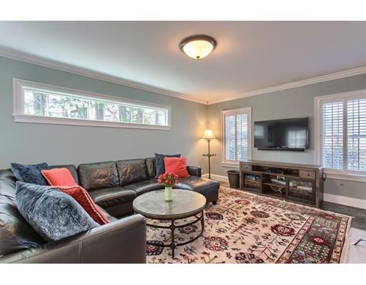 24 Paul Revere Road Needham, MA 02494 - Photo 6 of 30 a living room with furniture and a flat screen tv