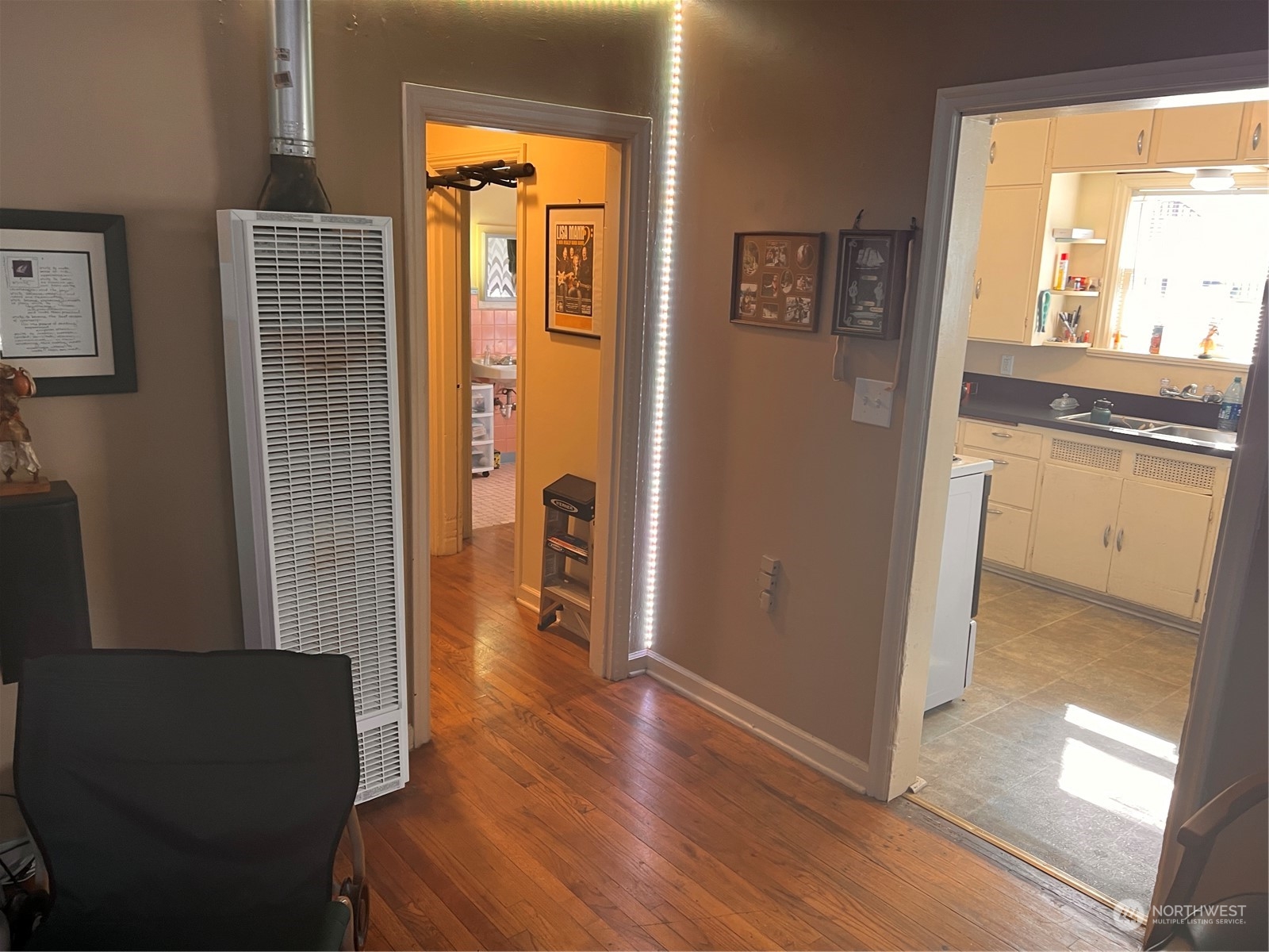 1201 Pacific Avenue Everett, WA 98201 - Photo 13 of 24 a view of a hallway with wooden floor and a dining room