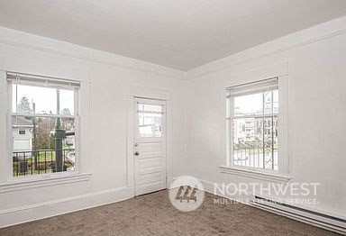 1201 Pacific Avenue Everett, WA 98201 - Photo 19 of 24 a view of a livingroom with an empty room and a window