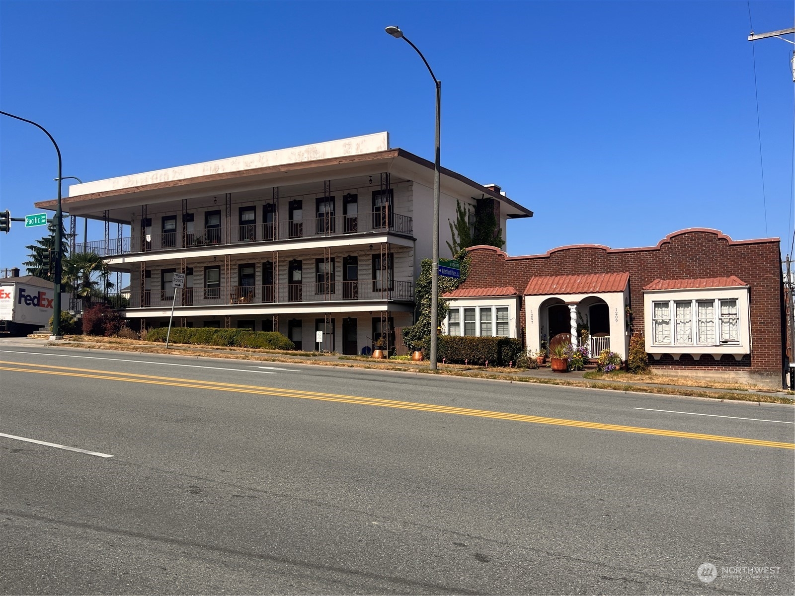 1201 Pacific Avenue Everett, WA 98201 - Photo 3 of 24 a front view of a house with a yard