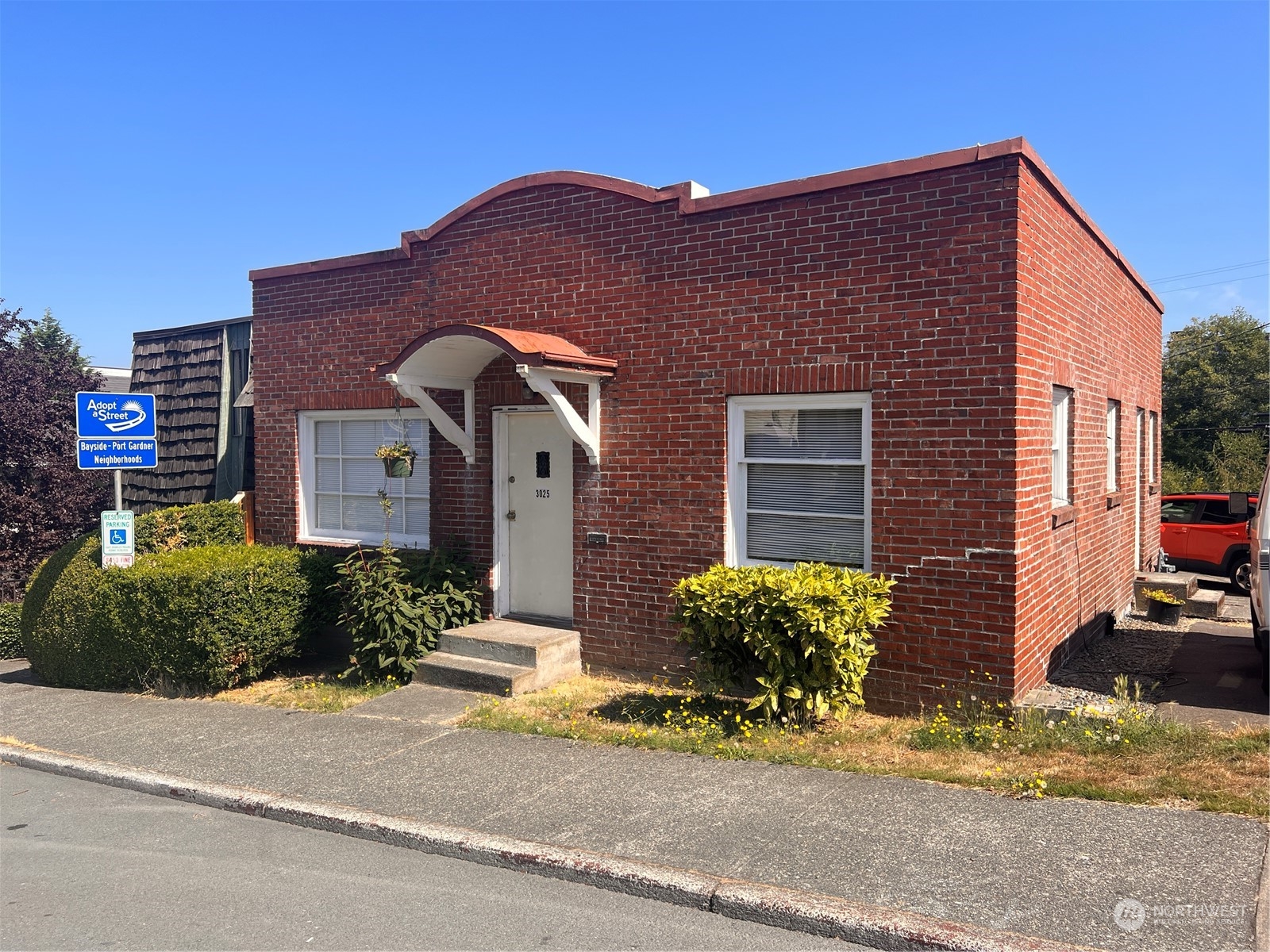 1201 Pacific Avenue Everett, WA 98201 - Photo 8 of 24 a front view of a house with a yard and garage