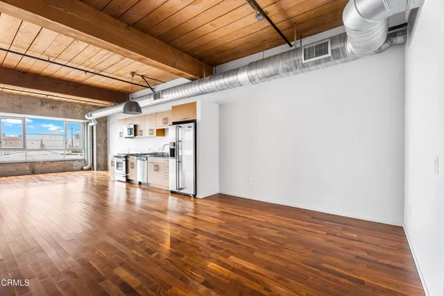 a view of a livingroom with wooden floor