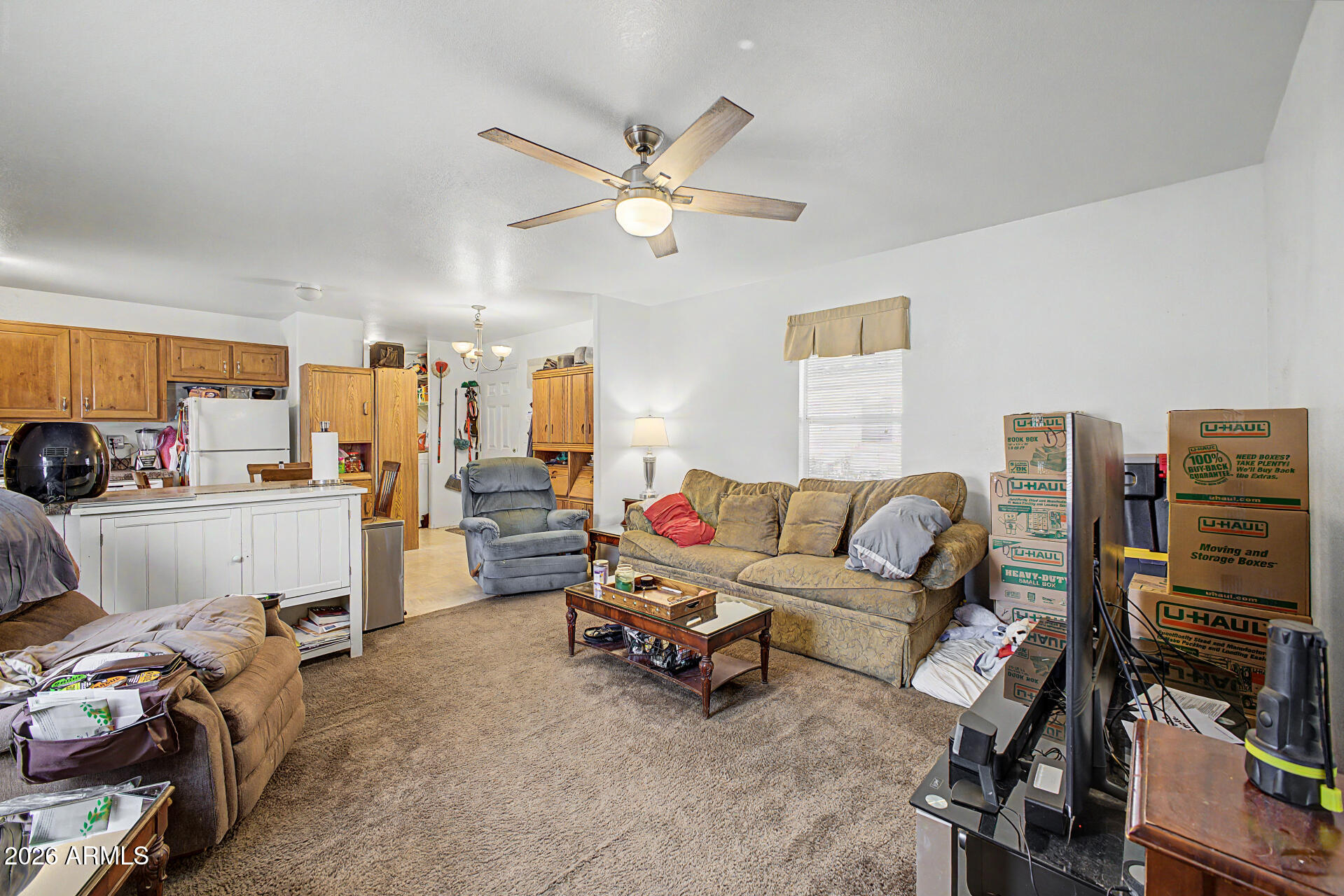 625 West McKellips Road, Unit 55 Mesa, AZ 85201 - Photo 5 of 21 a living room with furniture and a flat screen tv