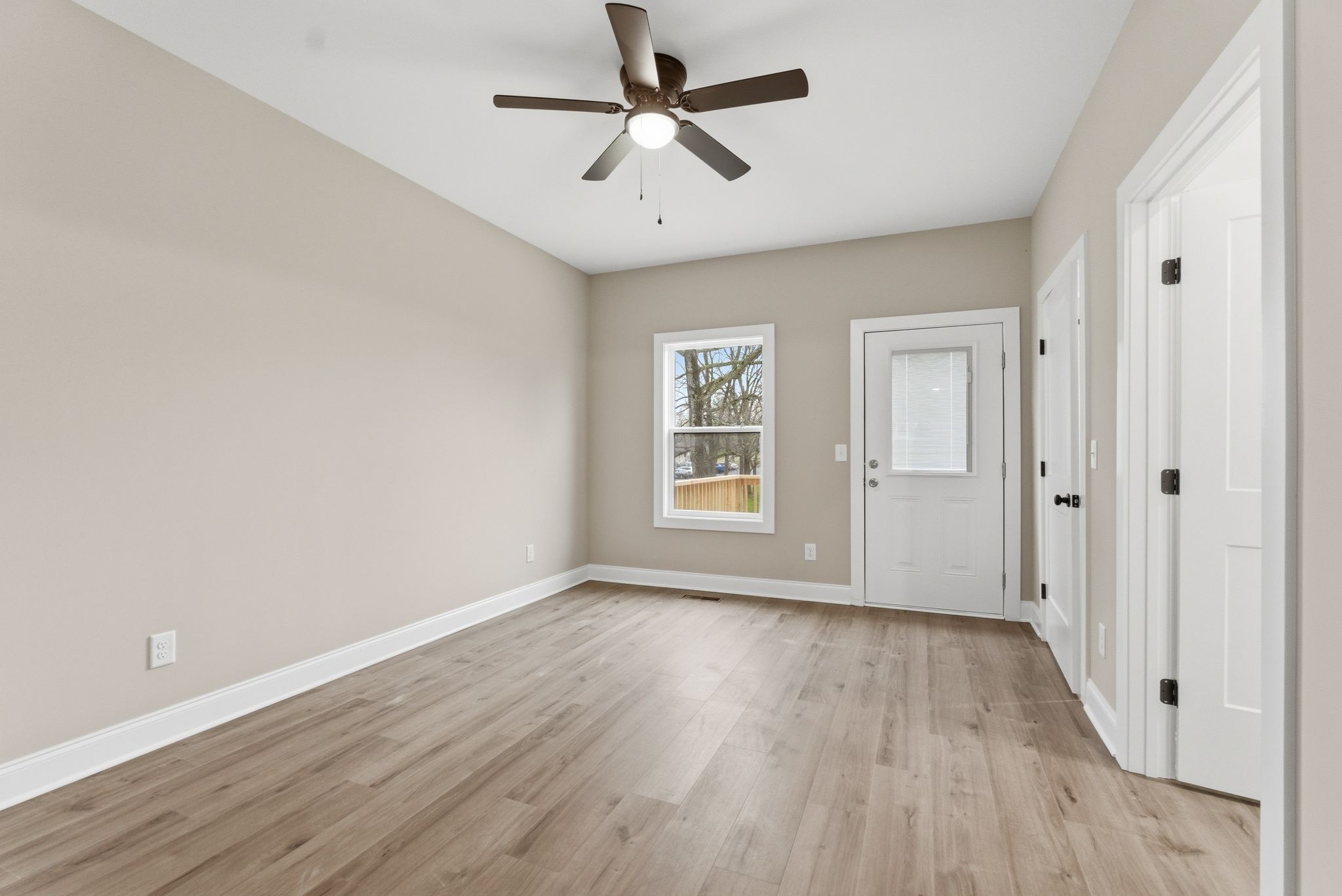 263 West Spring Street Smithville, TN 37166 - Photo 14 of 23 wooden floor in an empty room with a window