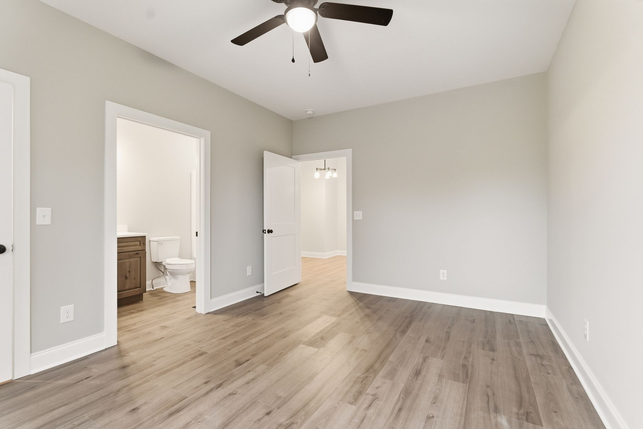 263 West Spring Street Smithville, TN 37166 - Photo 15 of 23 an empty room with wooden floor and ceiling fan